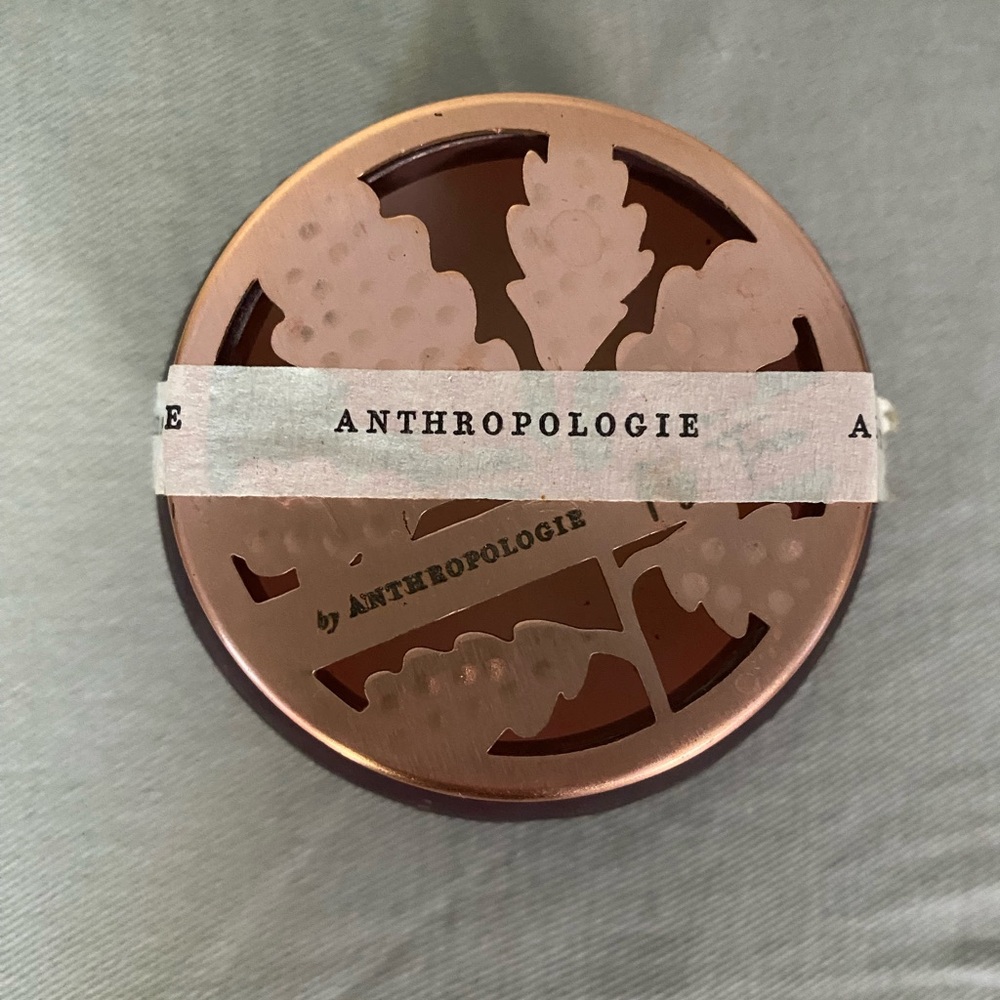 Anthropologie Fig Tree scented candle in burgundy glass cannister